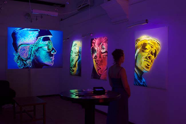 Blacklight art exhibition at a gallery in Rome