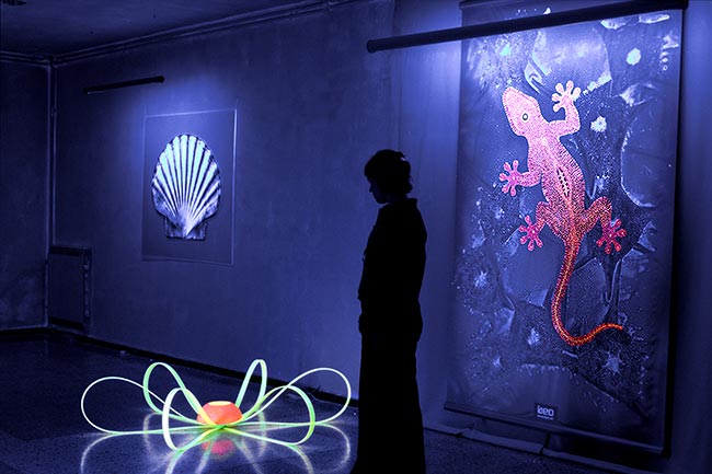 Contemporary Art exhibition illuminated with black light in Barcelona
